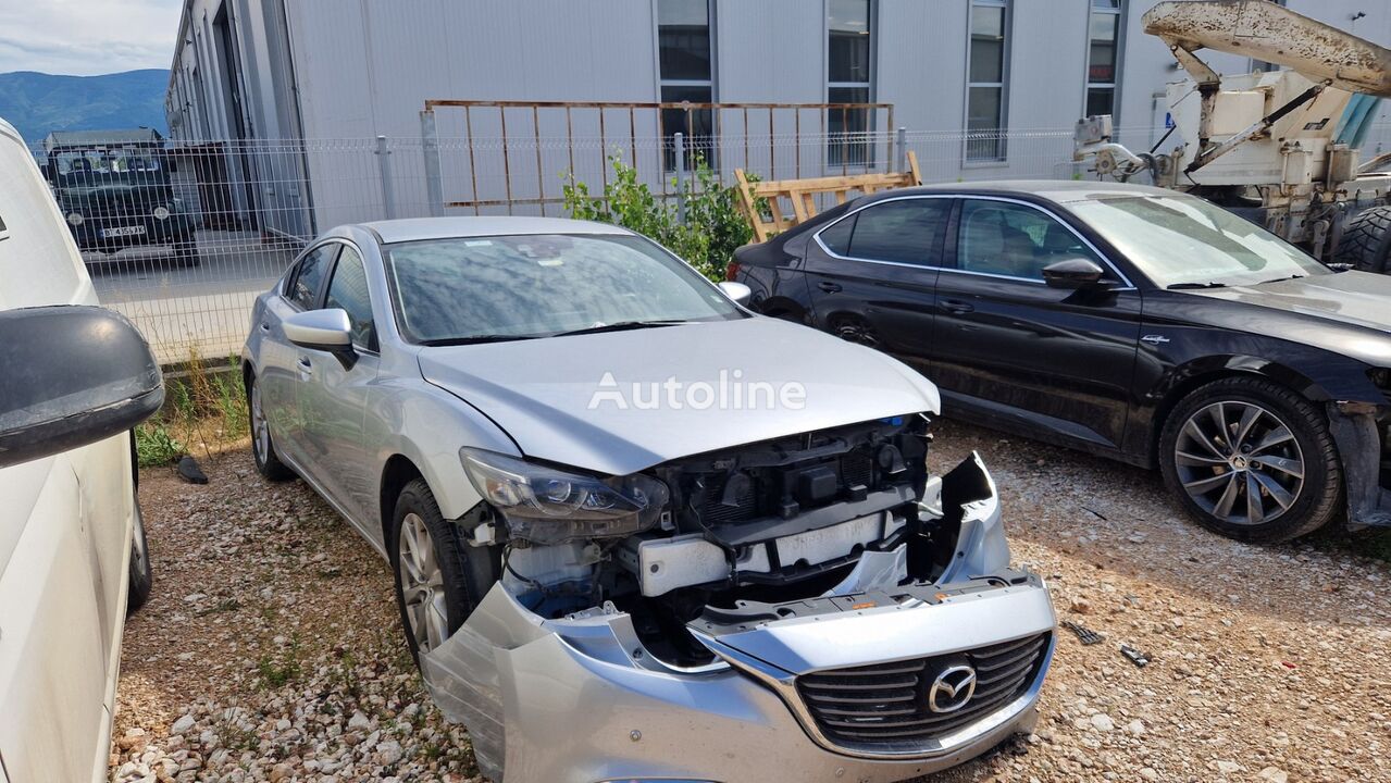 damaged Mazda 6 sedan