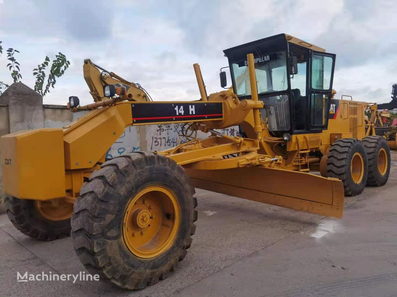 грейдер Caterpillar 140H