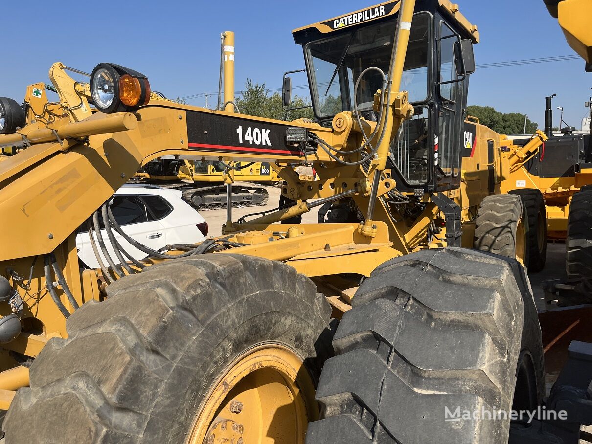 грейдер Caterpillar 140K