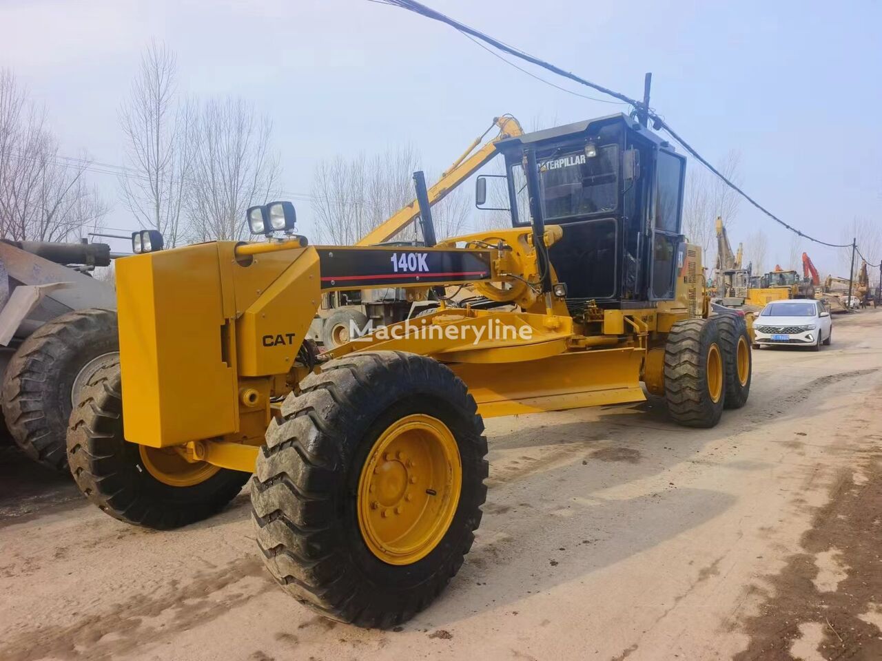 máy san đất Caterpillar 140K