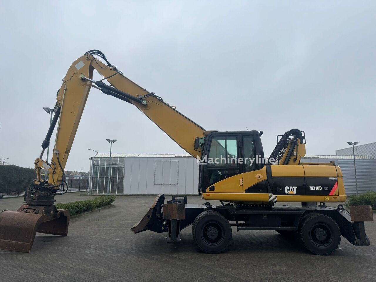 Caterpillar M318D MH manipulador de materiales