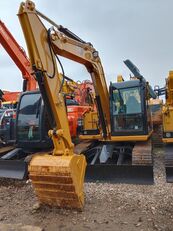 средний экскаватор Caterpillar 308E