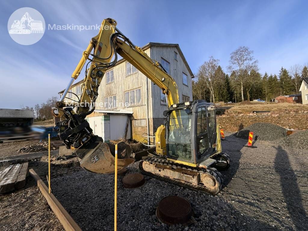 New Holland E 75 C SR mini bager