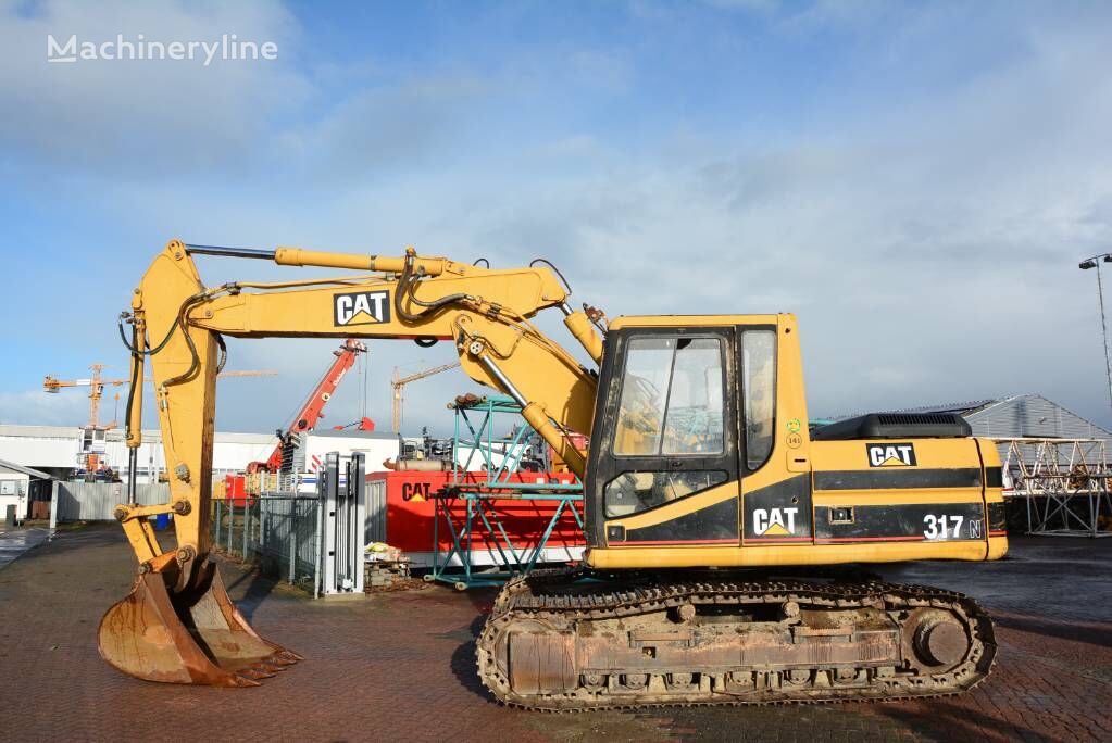 CAT 317 tracked excavator