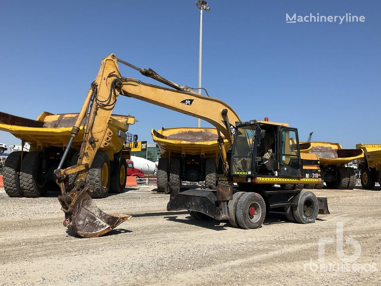 CAT M315 excavadora de ruedas