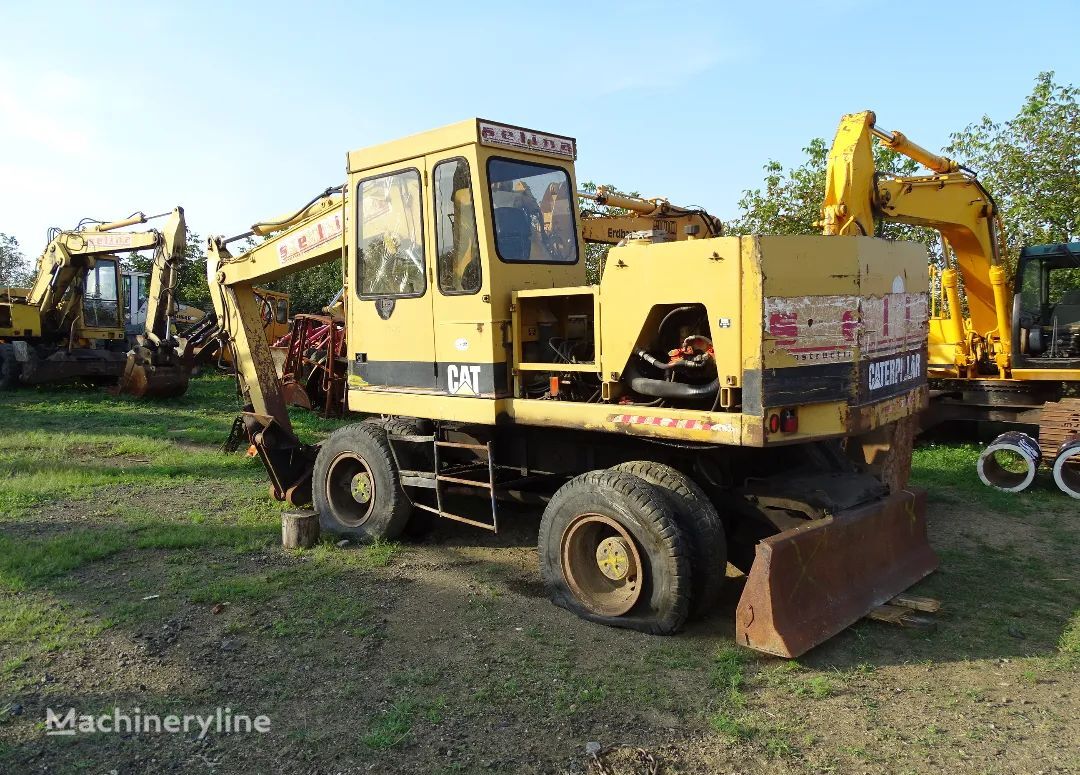 колесный экскаватор Caterpillar 206  si 212