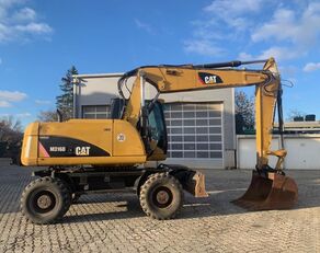 pelle sur pneus Caterpillar 316