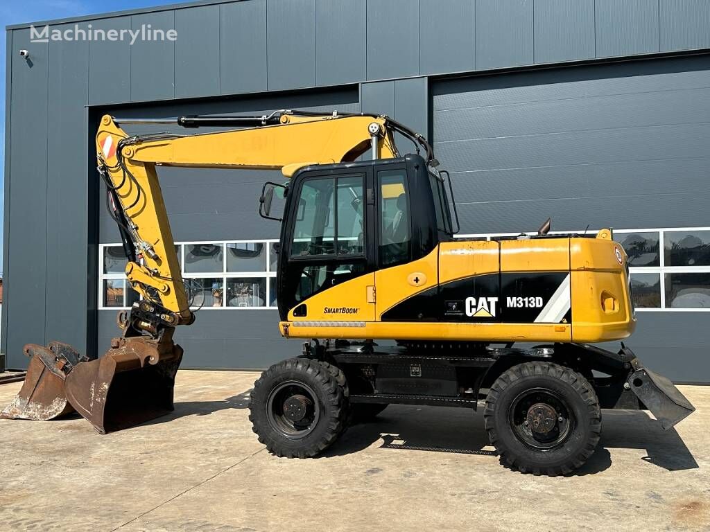 pelle sur pneus Caterpillar CAT M 313 D