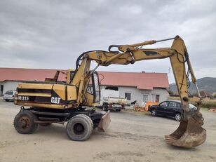 Caterpillar M 315(FOR PARTS) excavadora de ruedas