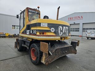 Caterpillar M312D excavadora de ruedas
