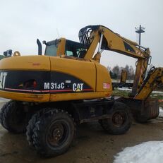 Caterpillar M313C riteņu ekskavators