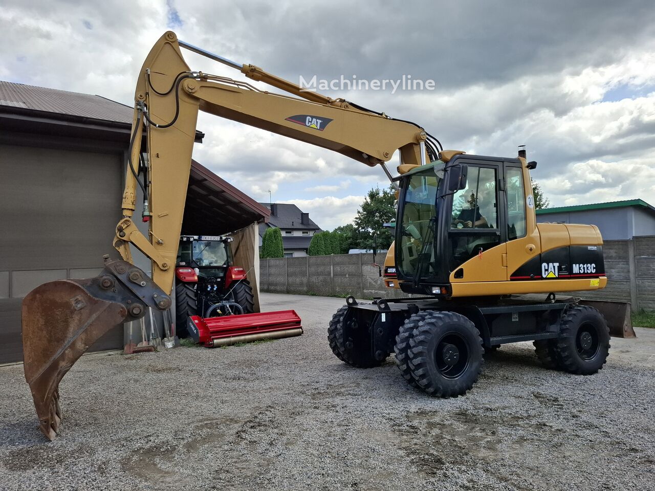 Caterpillar M313C wheel excavator - Machineryline