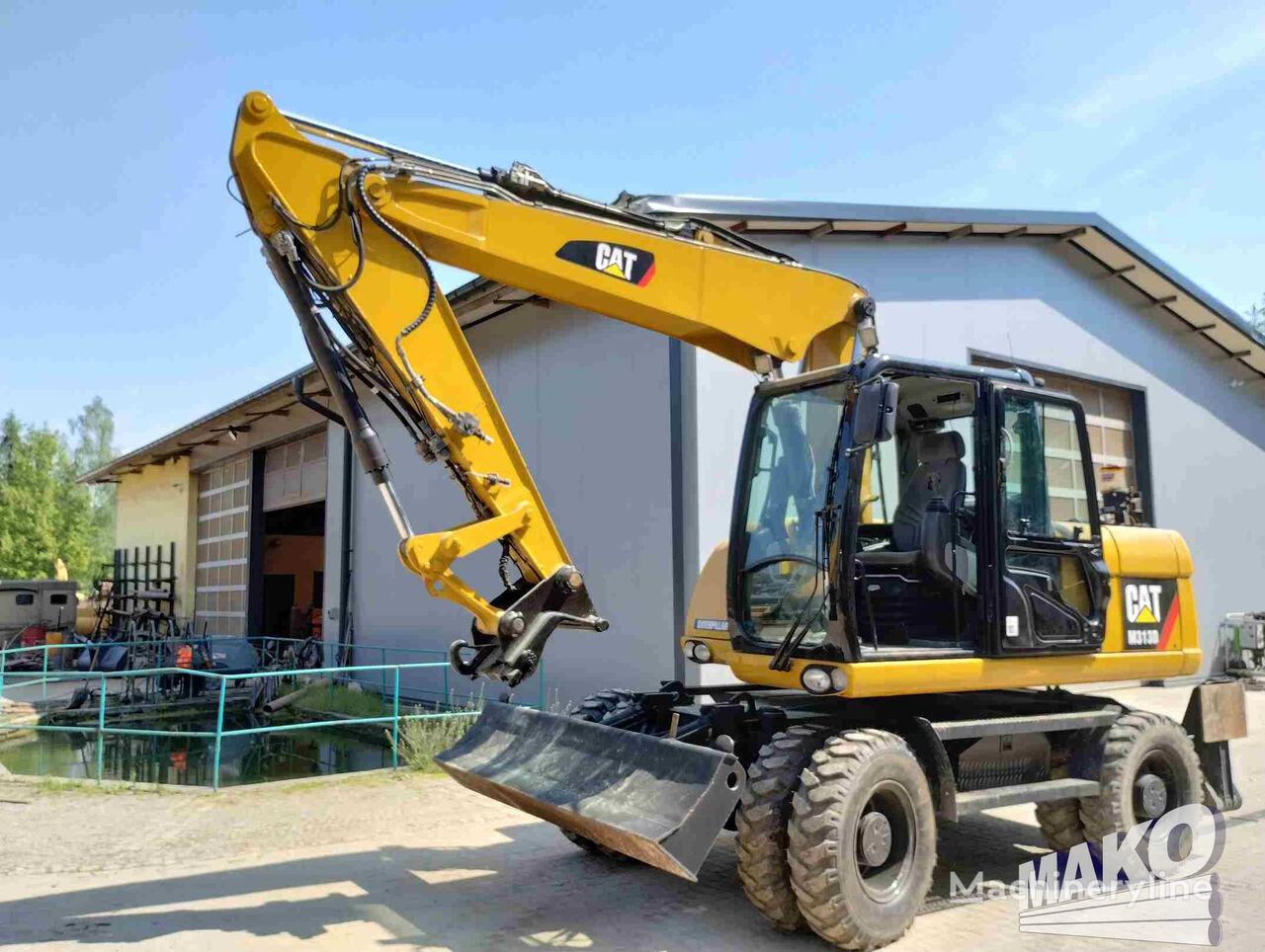 حفارة ذات العجلات Caterpillar M313D