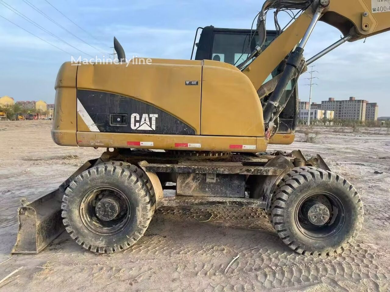 Escavadora de rodas Caterpillar M315 a venda | Machineryline BR Escavadora de rodas Caterpillar M315 - Machineryline