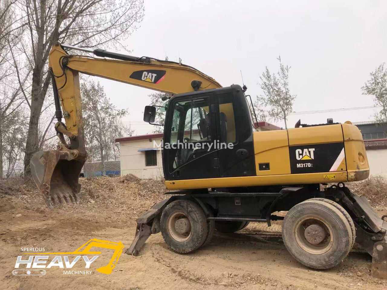 pelle sur pneus Caterpillar M317D2