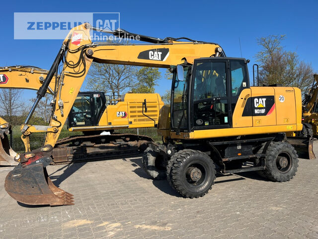Pelle sur pneus Caterpillar M318F - Machineryline
