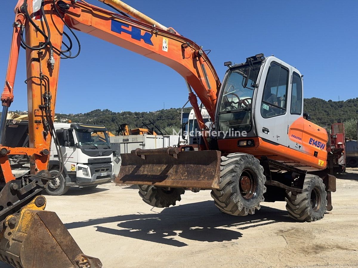 휠 굴착기 Fiat-Kobelco E145W - Machineryline