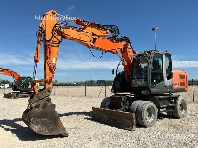 Pelle sur pneus Hitachi ZX140W-3 - Machineryline
