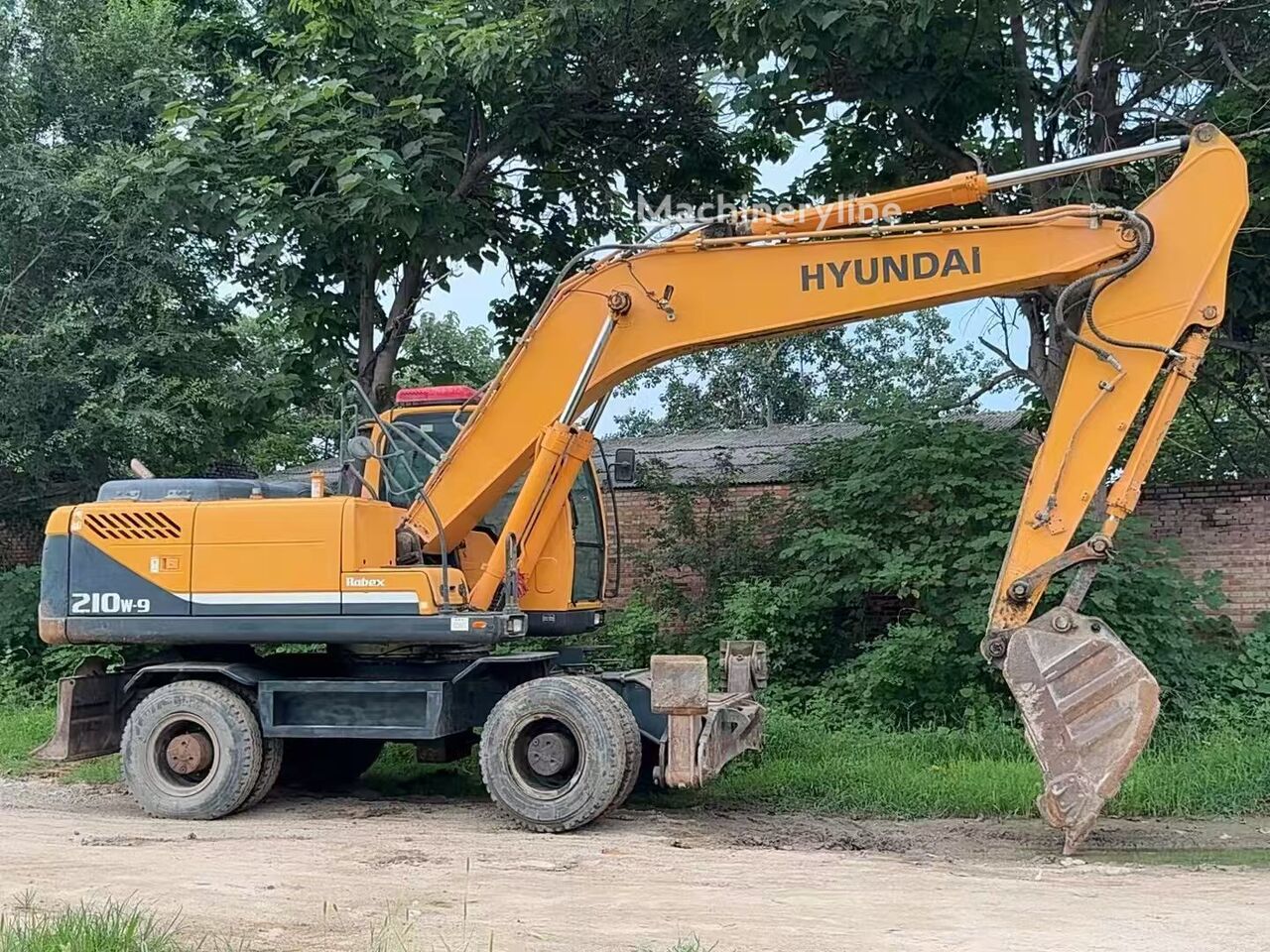 حفارة ذات العجلات Hyundai Robex 210-9 - Machineryline