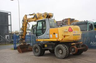 колесный экскаватор New Holland MH5 Plus