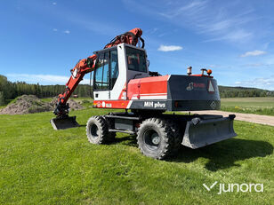 колесный экскаватор O&K MH Plus, Med tiltrotator