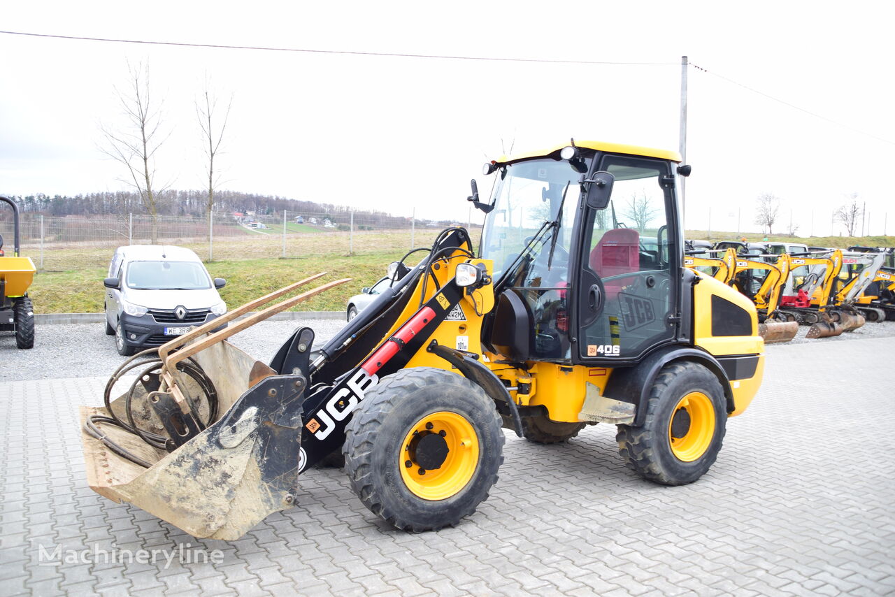 фронтальный погрузчик JCB 406 Toolmaster + Hammer JCB HM25