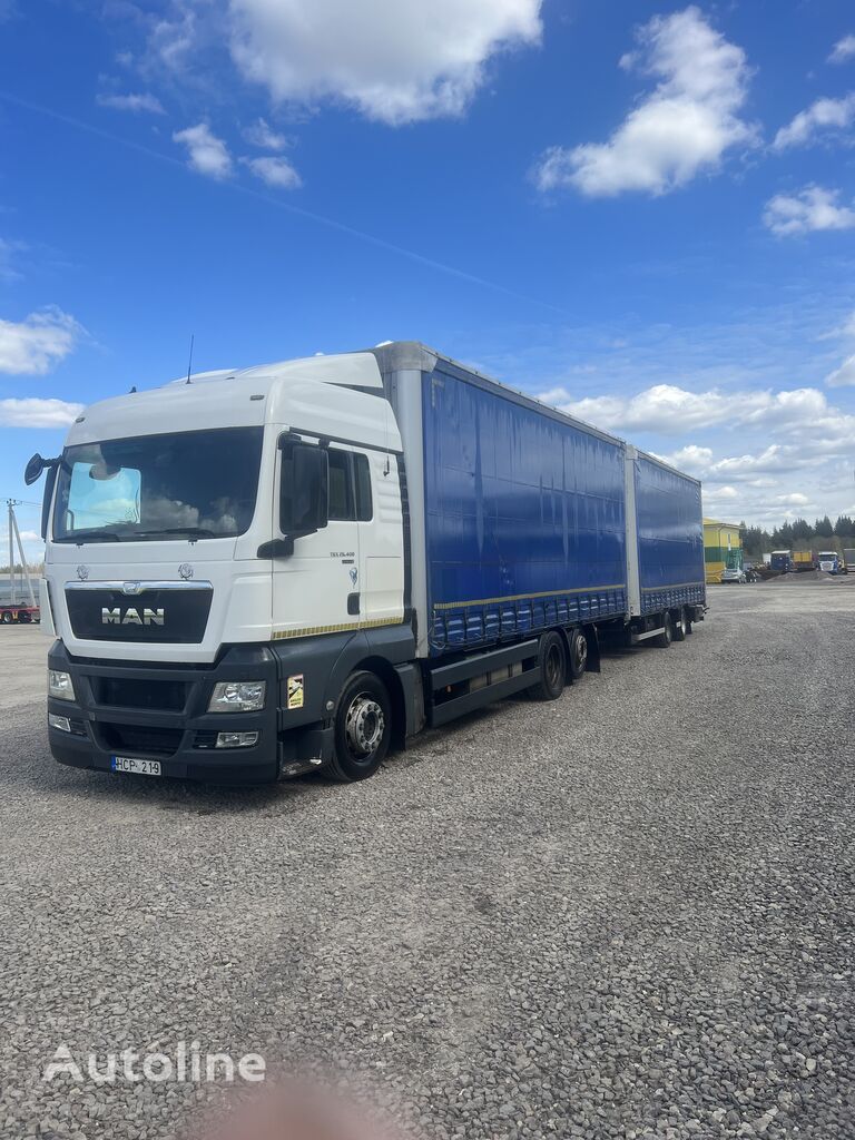 MAN TGX 18.400 camión con lona corredera + remolque con lona corredera