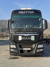 MAN TGX 26.440 camión con lona corredera + remolque con lona corredera