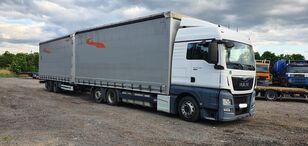 MAN TGX 480  kapellbil + gardintrailer