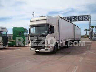 شاحنة ذات أغطية جانبية Scania R144 LB + مقطورة ستارة