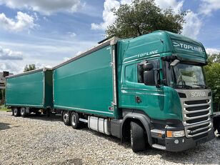 شاحنة ذات أغطية جانبية Scania R450 + مقطورة ستارة