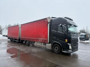 cami&atilde;o com lona deslizante Volvo FH500 + reboque com cortina lateral