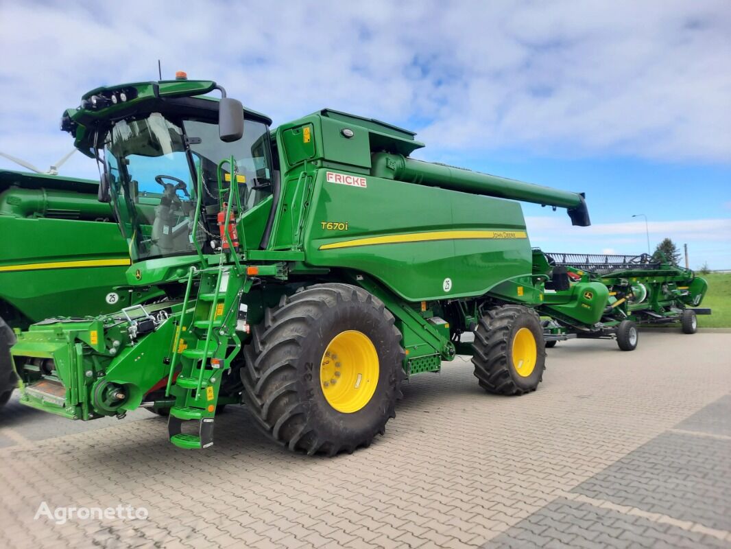 new John Deere T670 grain harvester