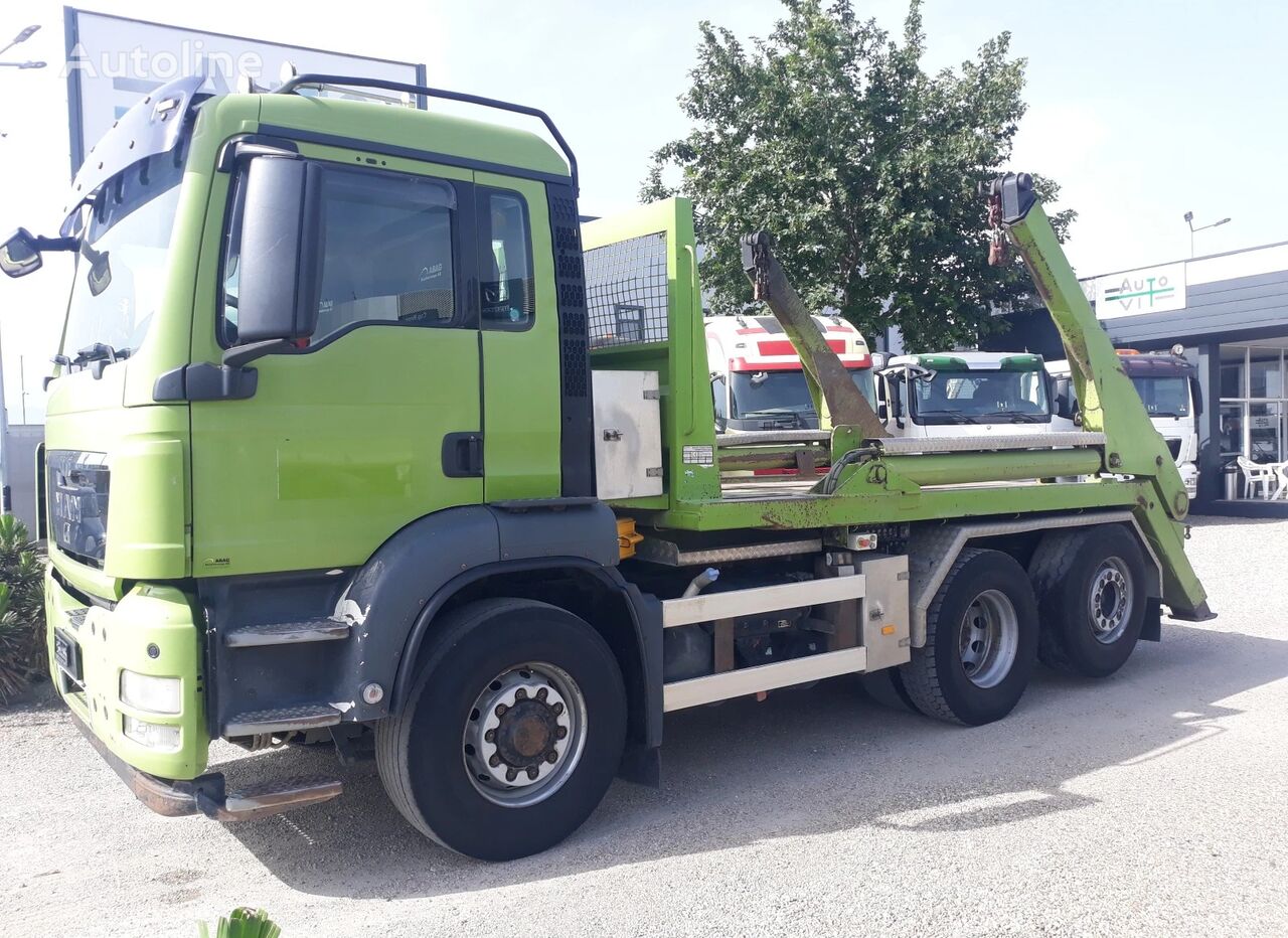 MAN skip loader truck