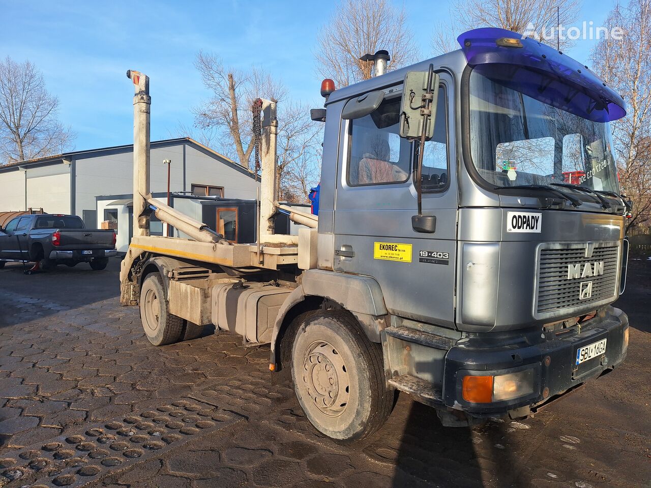 MAN skip loader truck