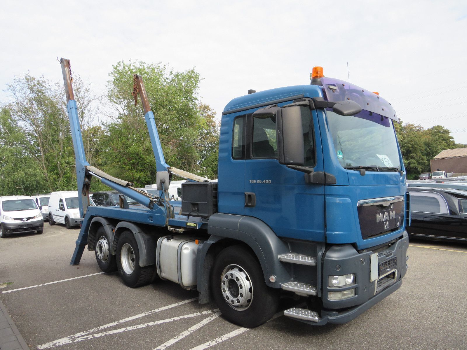 MAN TGS 26.400 skip loader truck