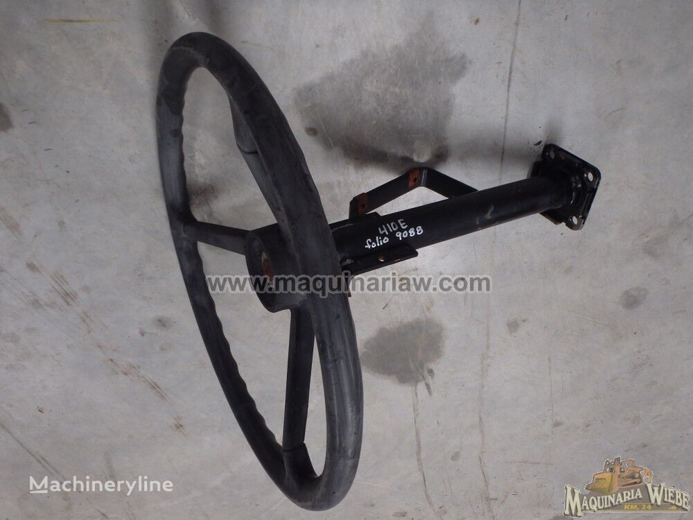 AT139694 steering wheel for John Deere 410E articulated dump truck