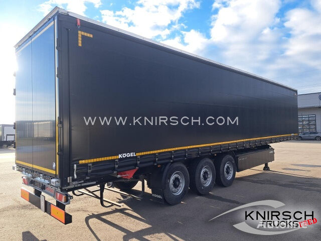 new Kögel SN 24 Pritschenauflieger mit Plane tilt semi-trailer