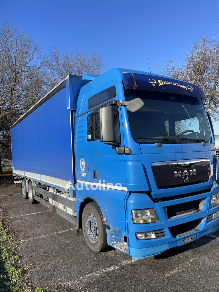 MAN TGX 26.440 tilt truck