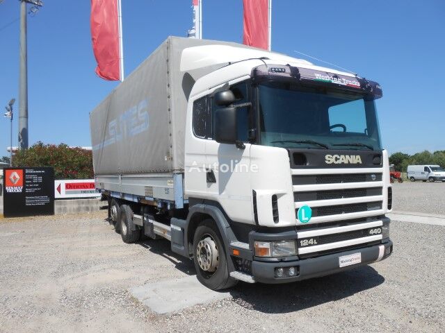 Scania 124L440 camión toldo