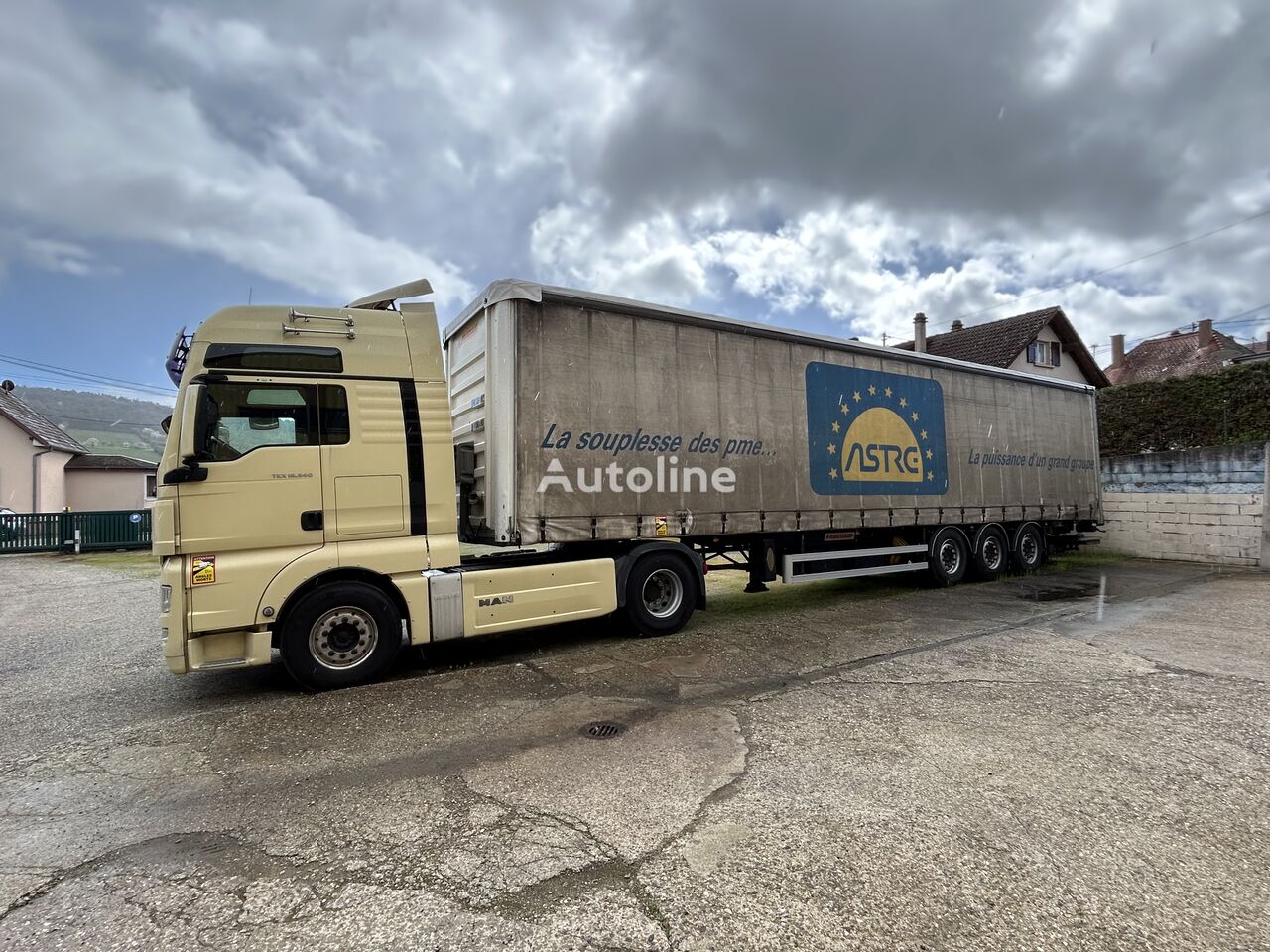 tracteur routier MAN TGX 18.560 + semi-remorque à rideaux coulissants