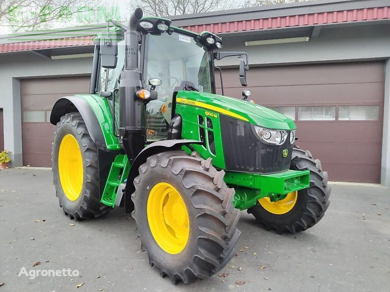 John Deere 6100m wielen trekker