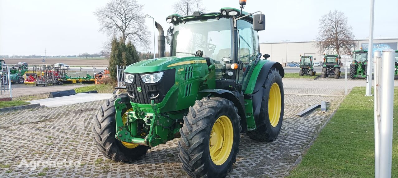 трактор колесный John Deere 6115R